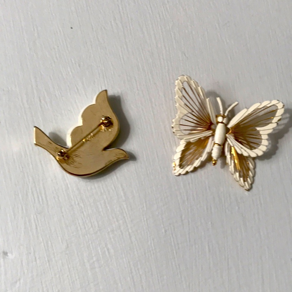 Gold and white pins one butterfly and one dove not used